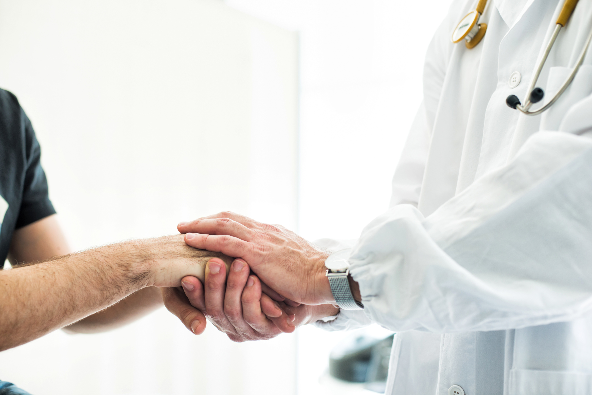 Doctor Holding Patient's Hands